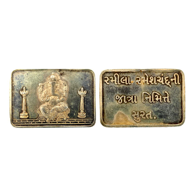 Ganesha, rectangular bar, Silver, 15g. Obv. Ganesha seated on a pedestal between two lamp 
